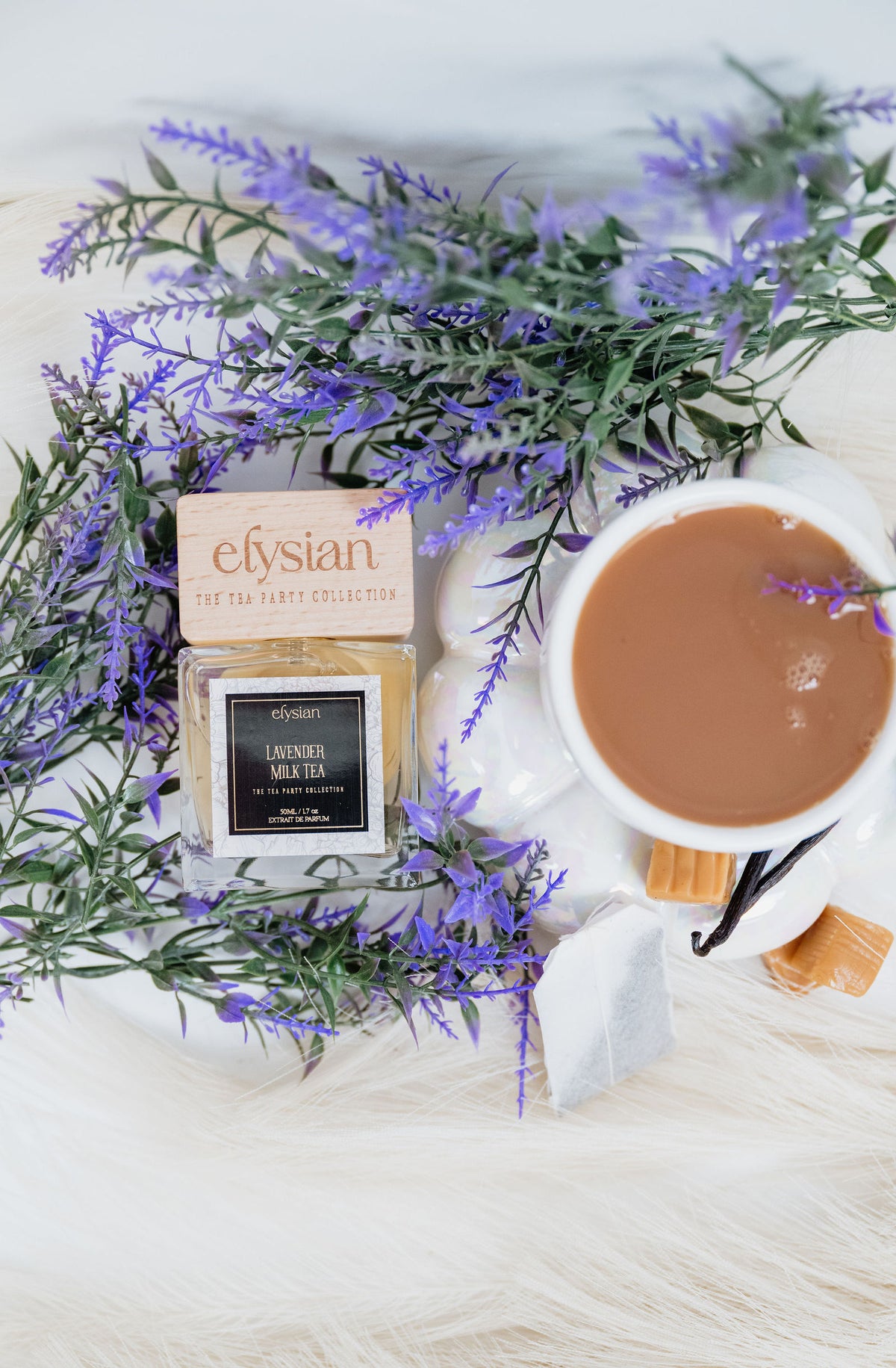 A cup of milk tea with lavender beside Lavender Milk Tea
