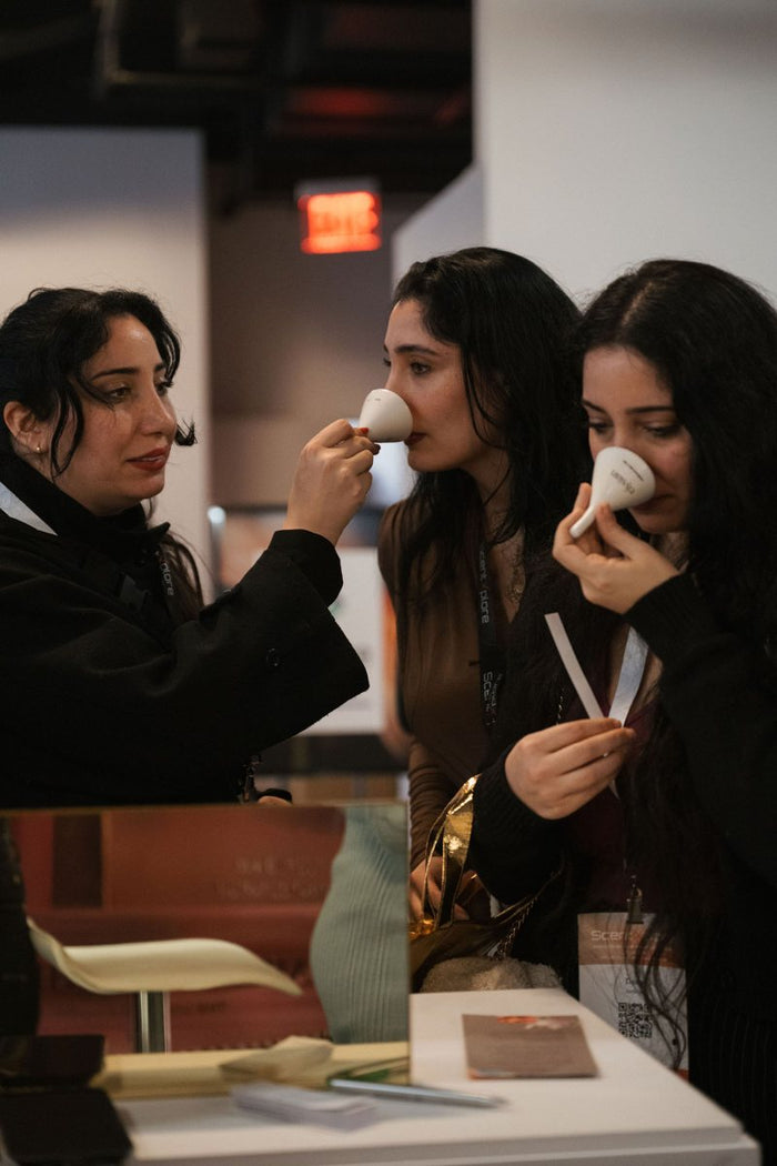 Three friends smelling Elysian samples together
