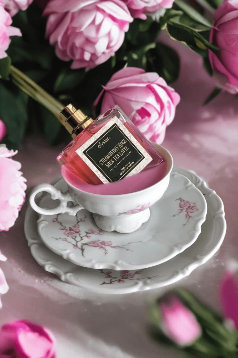 Strawberry Rose Milk Tea with a porcelain teacup and roses