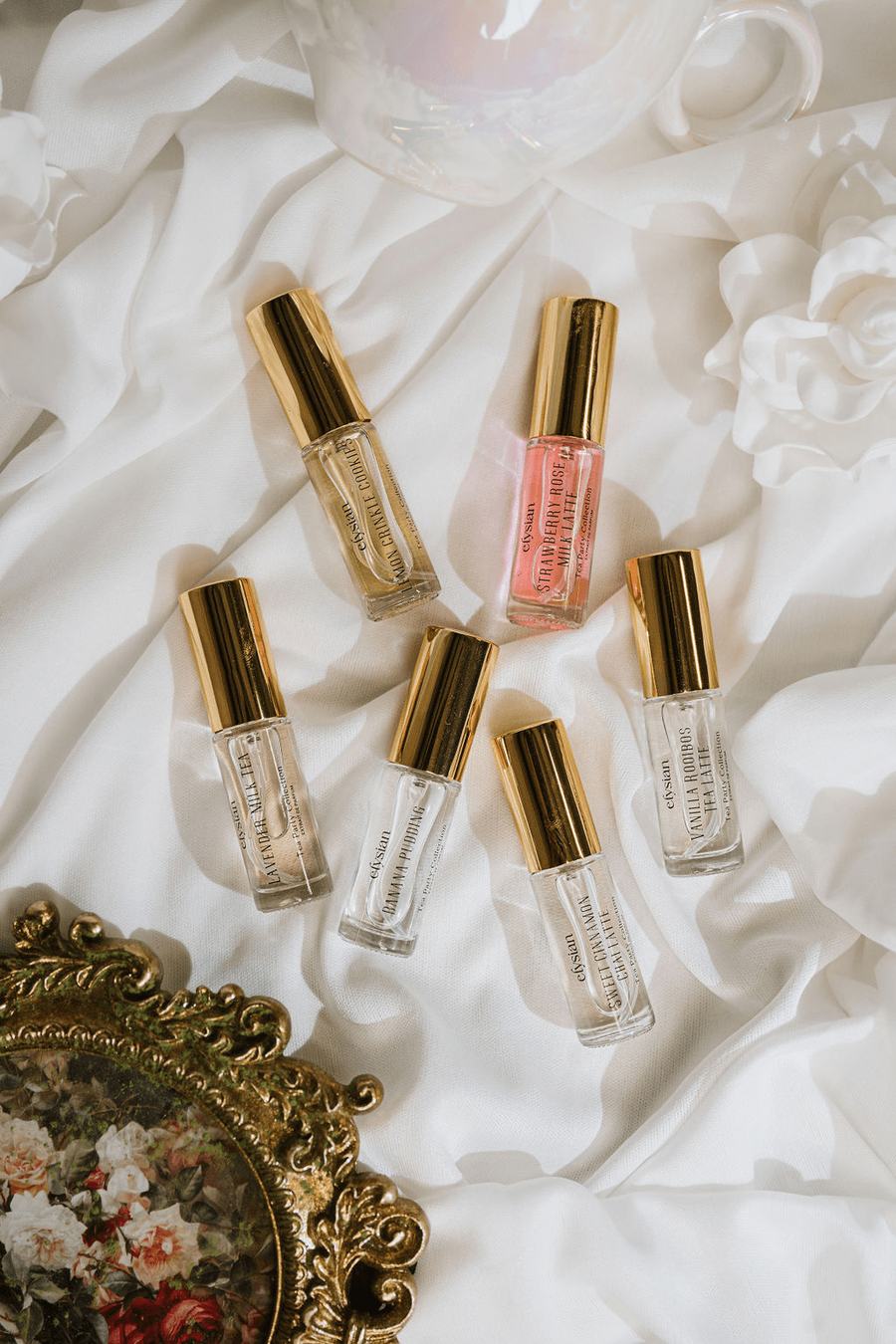 Tea Party travel spray vials on white silk